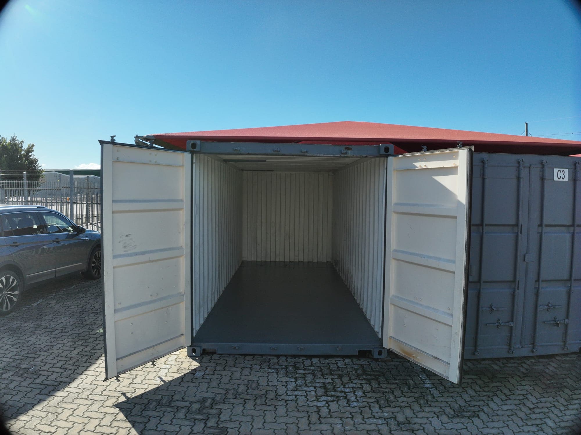 Open empty steel shipping container